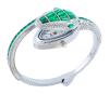 <span class='ref_item'>205 -</span> <span class="object_title">RELOJ DE PULSERA EN METAL PLATEADO, CRISTALES VERDES E INCOLOROS. CUARZO</span>  <p><span class="technical_description">Reloj de pulsera en metal plateado de la marca Cussi, con movimiento de cuarzo. Con forma de serpiente cuajada por cristales verdes en tallas marquise, baguette y trapecio, y cristales incoloros en talla brillante. Debajo de la cabeza de la serpiente se encuentra la esfera del reloj. Brazalete abierto semirrígido. En estado de marcha.<br/>Diámetro: 7cm</span><br>Peso: <span class="PESO_HCES1">46,40</span> <span class="PESOUMED_HCES1">gr.</span><br></p>