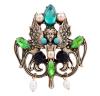 <span class='ref_item'>57 -</span> <span class="object_title">BROCHE DE METAL DORADO Y PIEDRAS Y PERLAS DE IMITACIÓN</span>  <p><span class="technical_description">Broche de inspiración modernista realizado en metal dorado. En su centro la figura de una efigie alada rodeada por turquesinas, piedras de imitación verdes y azules, y perlas de imitación de color golden. Colgando en su parte inferior dos perlas imitación con forma barrilete.<br/>Cierre. Aguja<br/>Medidas: 5,5 x 5cm</span><br>Peso: <span class="PESO_HCES1">19,60</span> <span class="PESOUMED_HCES1">gr.</span><br></p>