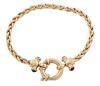 <span class='ref_item'>215 -</span> <span class="object_title">PULSERA EN ORO 18KT Y ZAFIROS</span>  <p><span class="technical_description">Pulsera realizada en oro de 18kt con cadena en espiga. Adornos laterales de cabujones de zafiros, engastados en bisel, con un peso total aprox de 0.45ct. <br/>Cierre: Reasa marinera<br/>Longitud: 17cm</span><br>Peso: <span class="PESO_HCES1">15,20</span> <span class="PESOUMED_HCES1">gr.</span><br></p>