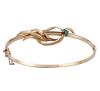 <span class='ref_item'>35 -</span> <span class="object_title">PULSERA EN ORO 18KT Y ESMERALDAS</span>  <p><span class="technical_description">Pulsera rígida realizada en oro de 18kt con sistema de bisagra. Con motivo de hojas adornado con tres pequeñas esmeraldas (dos de ellas fracturadas)<br/>Cierre: Caja con lengüeta y cadena de seguridad<br/>Diámetro: 6,5cm</span><br>Peso: <span class="PESO_HCES1">10,20</span> <span class="PESOUMED_HCES1">gr.</span><br></p>